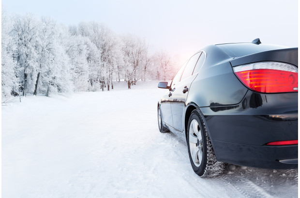 bigstock-Black-Car-On-A-Winter-Road-In--478006773.jpg