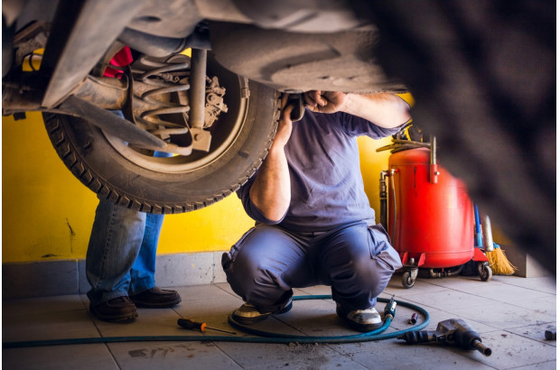 bigstock-Photo-Of-Car-Mechanics-Fixing-306737521.jpg